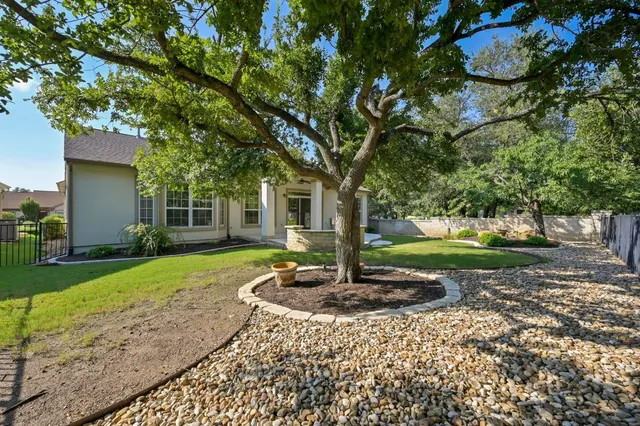 a house with tree in front of it