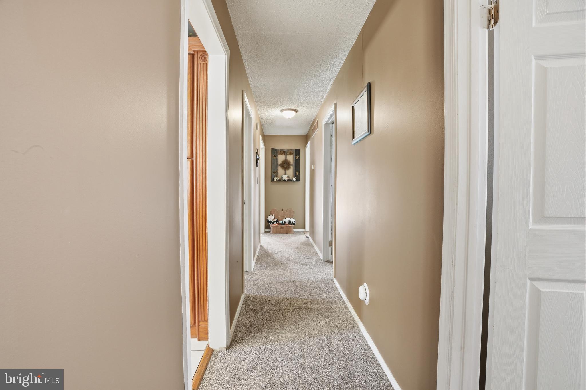 118 West Clinton Street Clayton, NJ 08312 - Photo 14 of 30 a view of a hallway with wooden floor