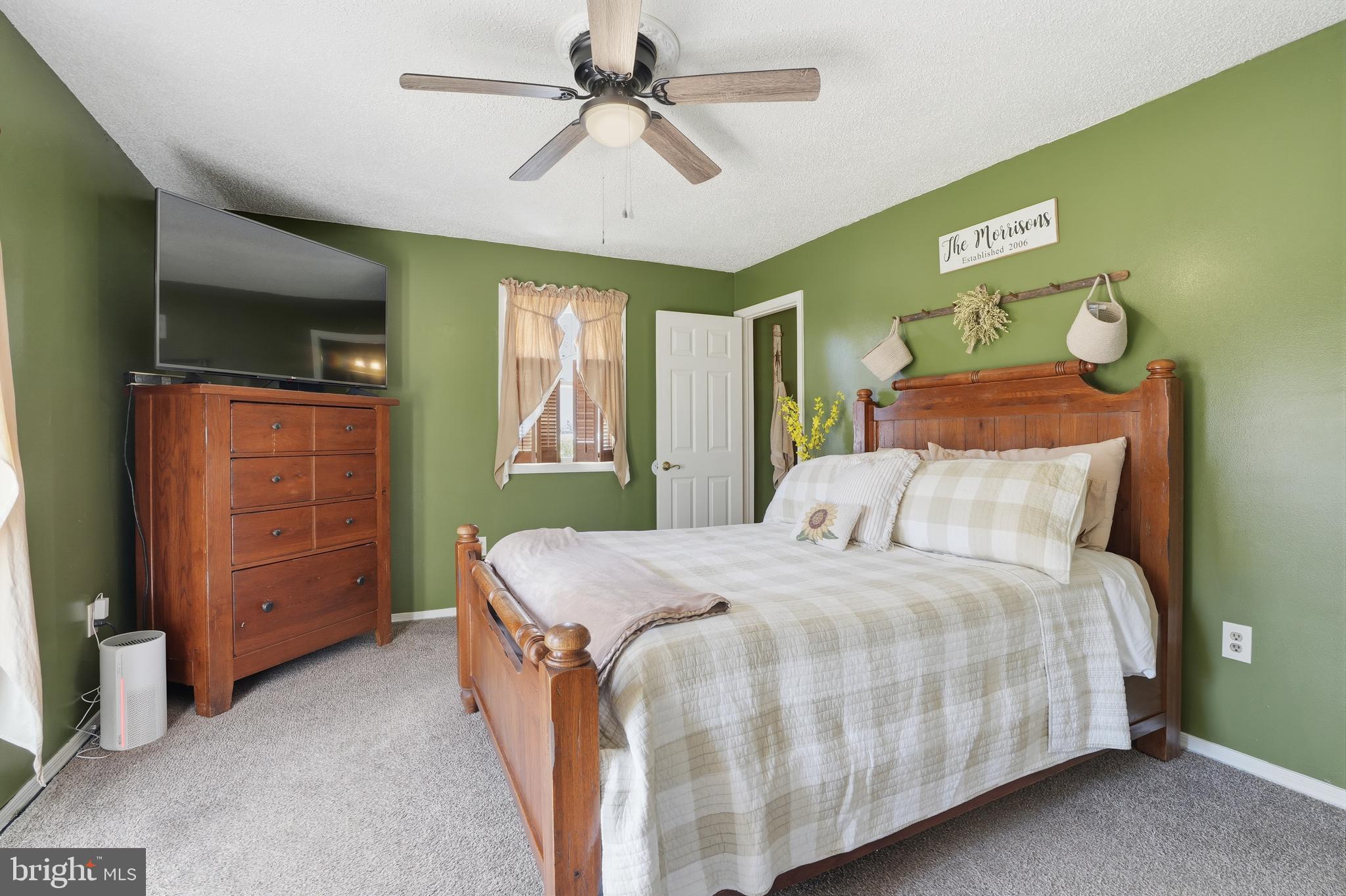 118 West Clinton Street Clayton, NJ 08312 - Photo 15 of 30 a bedroom with a bed and a dresser