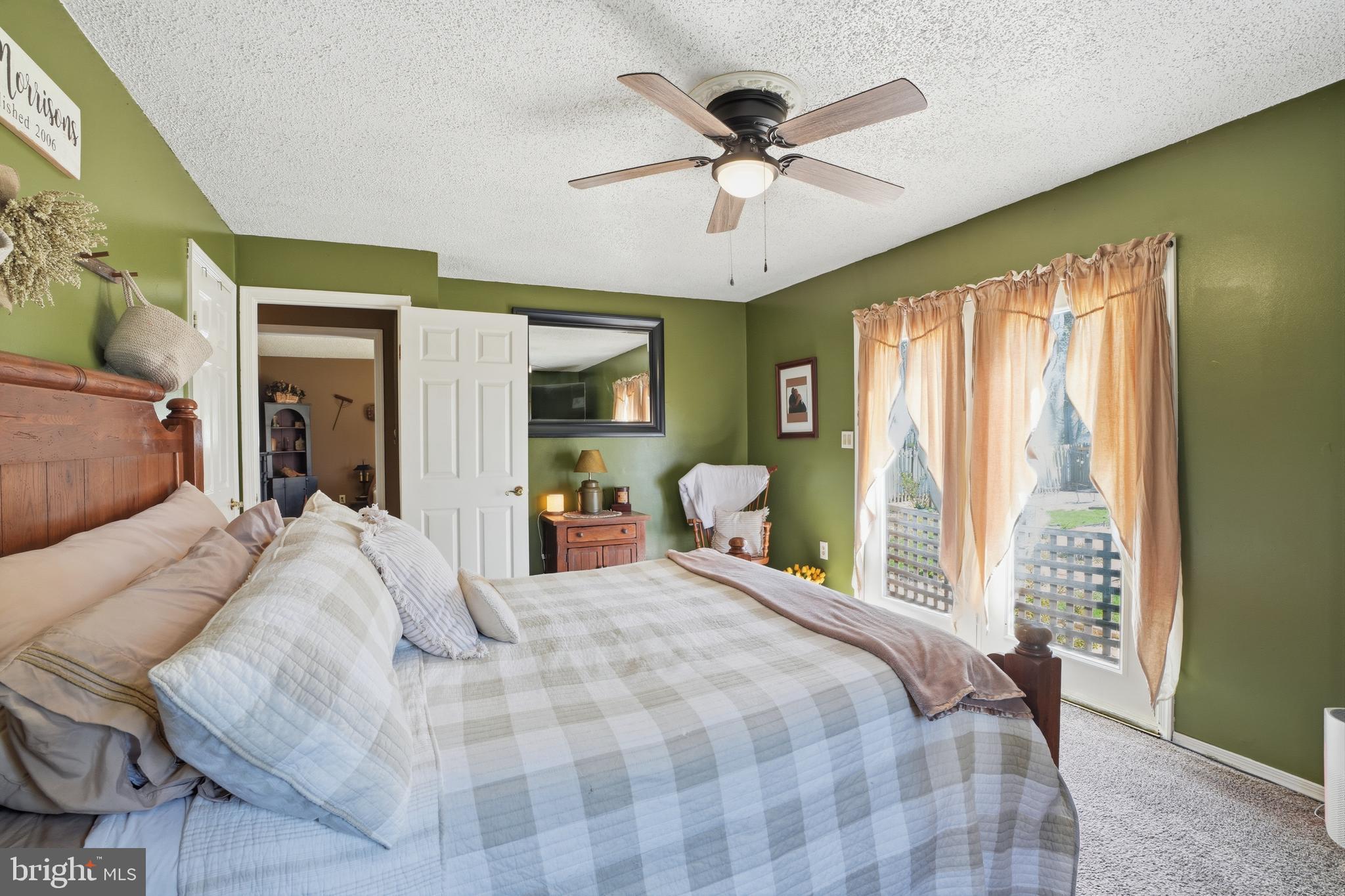 118 West Clinton Street Clayton, NJ 08312 - Photo 16 of 30 a bedroom with a bed window and a ceiling fan