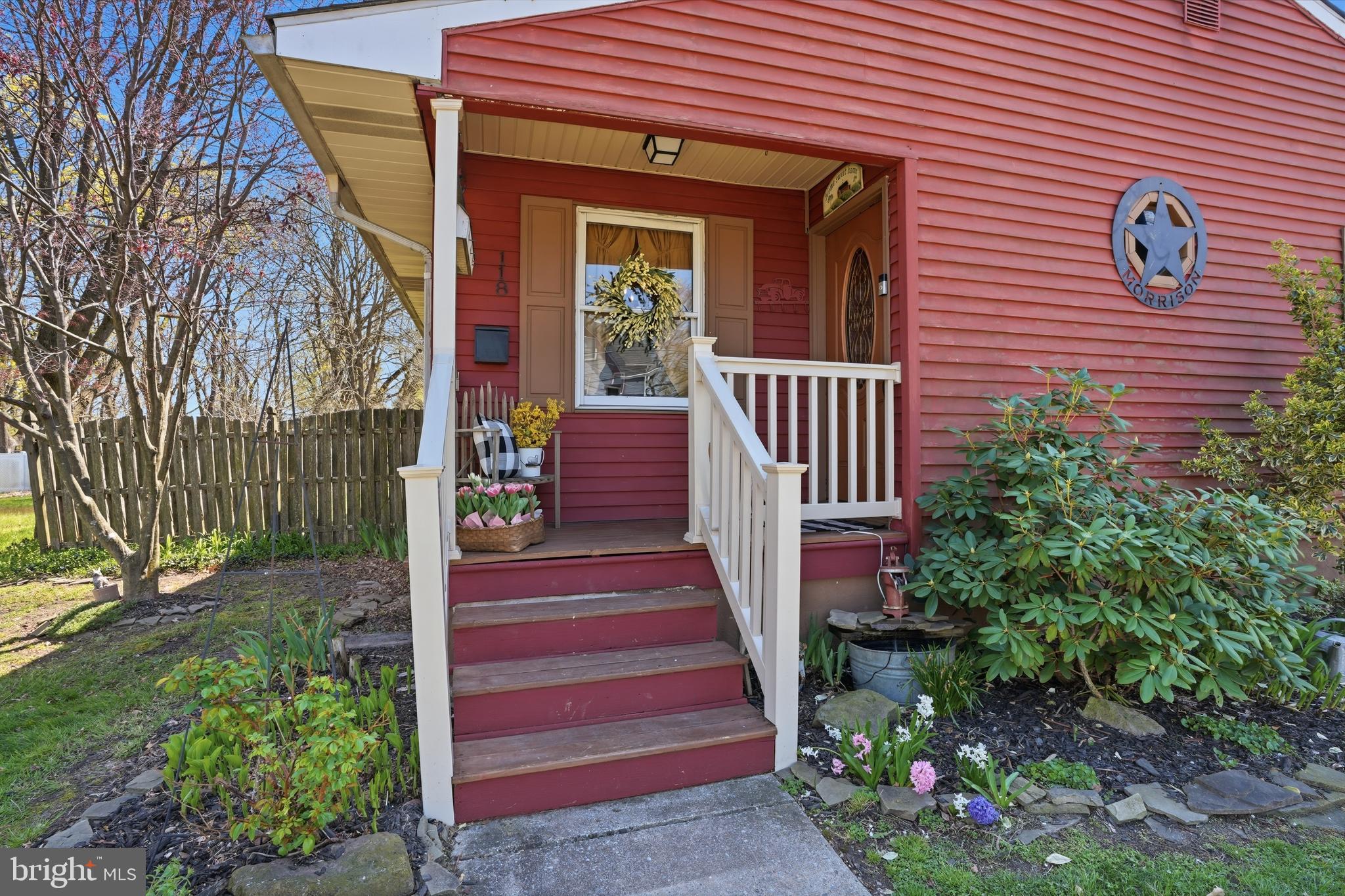 118 West Clinton Street Clayton, NJ 08312 - Photo 2 of 30 a front view of a house with a garden