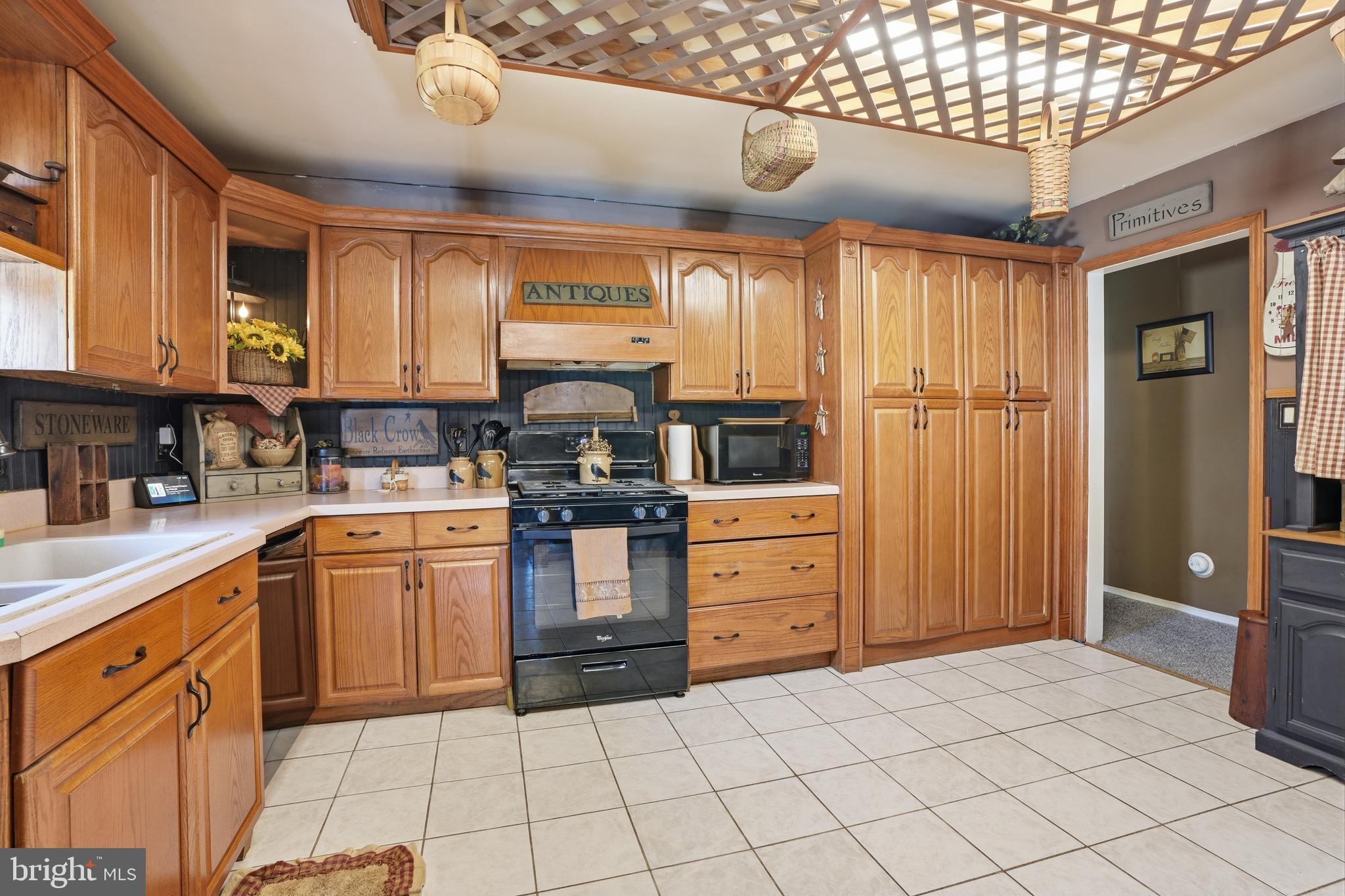 118 West Clinton Street Clayton, NJ 08312 - Photo 7 of 30 a kitchen with a stove a sink and a refrigerator