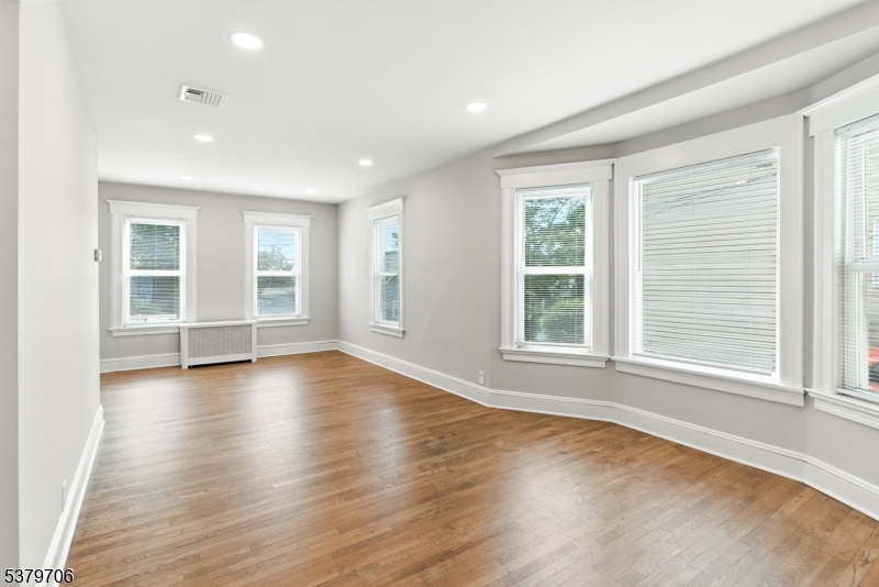45 Oakridge Road West Orange, NJ 07052 - Photo 14 of 35 an empty room with wooden floor and windows