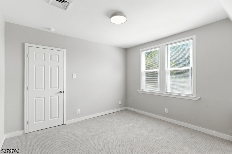 45 Oakridge Road West Orange, NJ 07052 - Photo 16 of 35 an empty room with windows