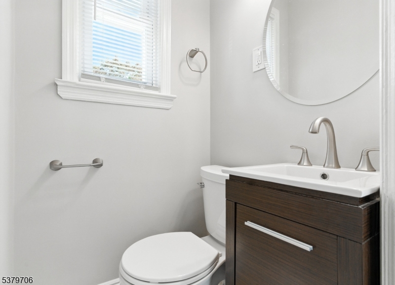 45 Oakridge Road West Orange, NJ 07052 - Photo 28 of 35 a bathroom with a toilet sink and mirror