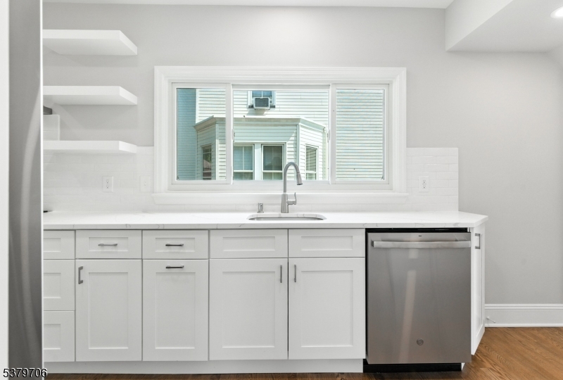 45 Oakridge Road West Orange, NJ 07052 - Photo 5 of 35 a view of cabinets a sink and dishwasher in a kitchen