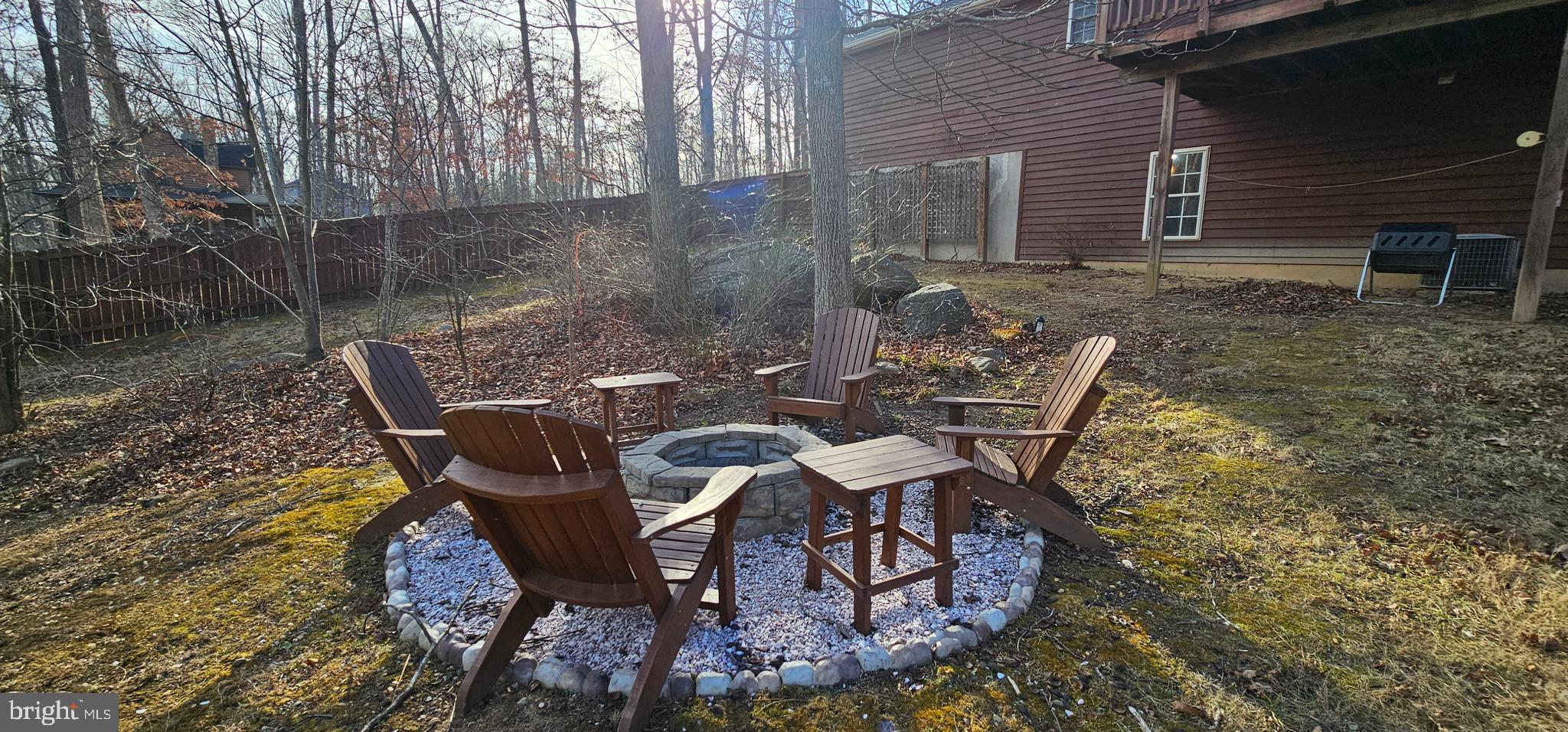 4078 Panhandle Road Front Royal, VA 22630 - Photo 19 of 23 a view of a patio with table and chairs with wooden floor and fence