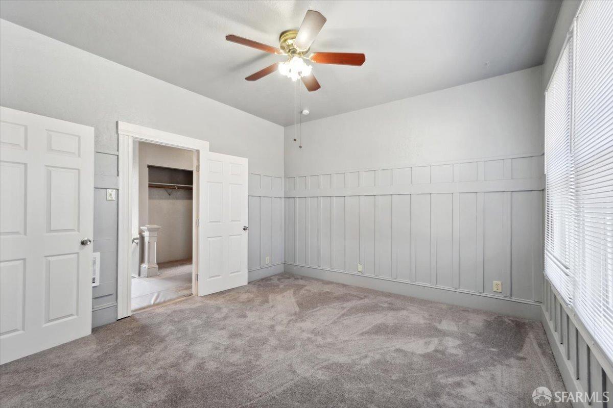 1309 80th Avenue Oakland, CA 94621 - Photo 23 of 75 wooden floor in an empty room with a window