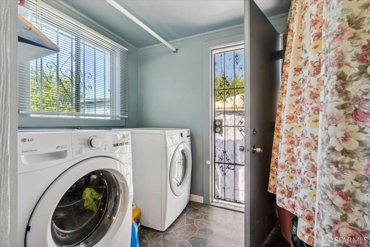1309 80th Avenue Oakland, CA 94621 - Photo 44 of 75 a utility room with dryer and washer