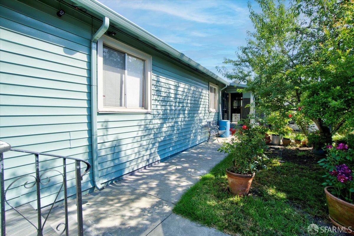 1309 80th Avenue Oakland, CA 94621 - Photo 57 of 75 a view of a backyard with plants and large trees