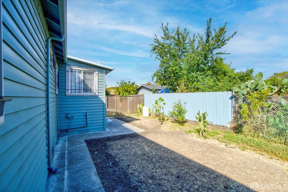 1309 80th Avenue Oakland, CA 94621 - Photo 63 of 75 a view of a pathway of a house with wooden fence