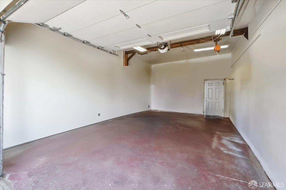 1309 80th Avenue Oakland, CA 94621 - Photo 75 of 75 an empty room with a ceiling fan and window