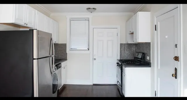 a view of walk in closet with cabinets