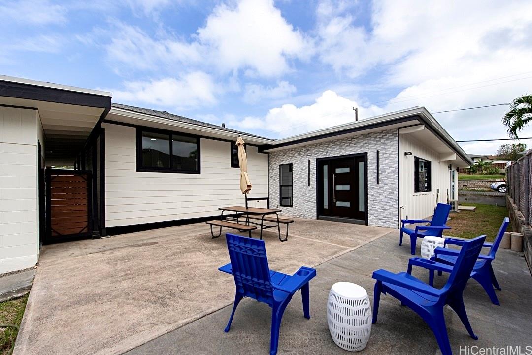 1159 Loho Street Kailua, HI 96734 - Photo 22 of 25 a backyard of a house with table and chairs