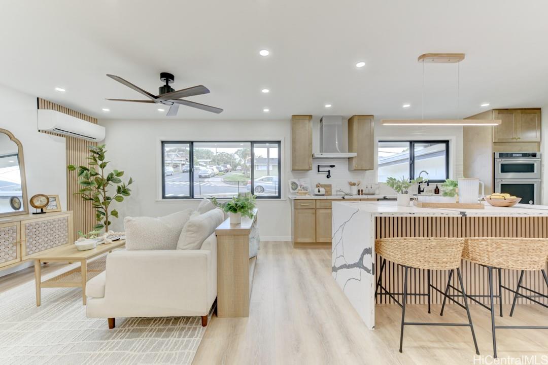 1159 Loho Street Kailua, HI 96734 - Photo 4 of 25 a living room with kitchen island furniture and a large window