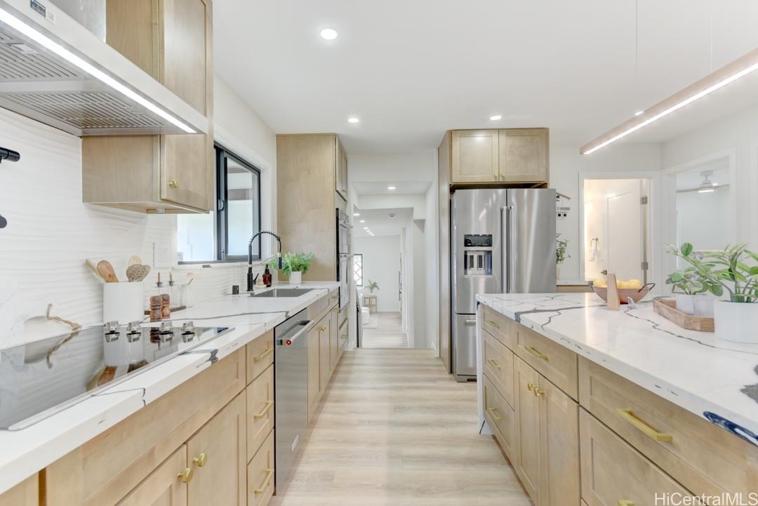 1159 Loho Street Kailua, HI 96734 - Photo 5 of 25 a large kitchen with a sink and stainless steel appliances