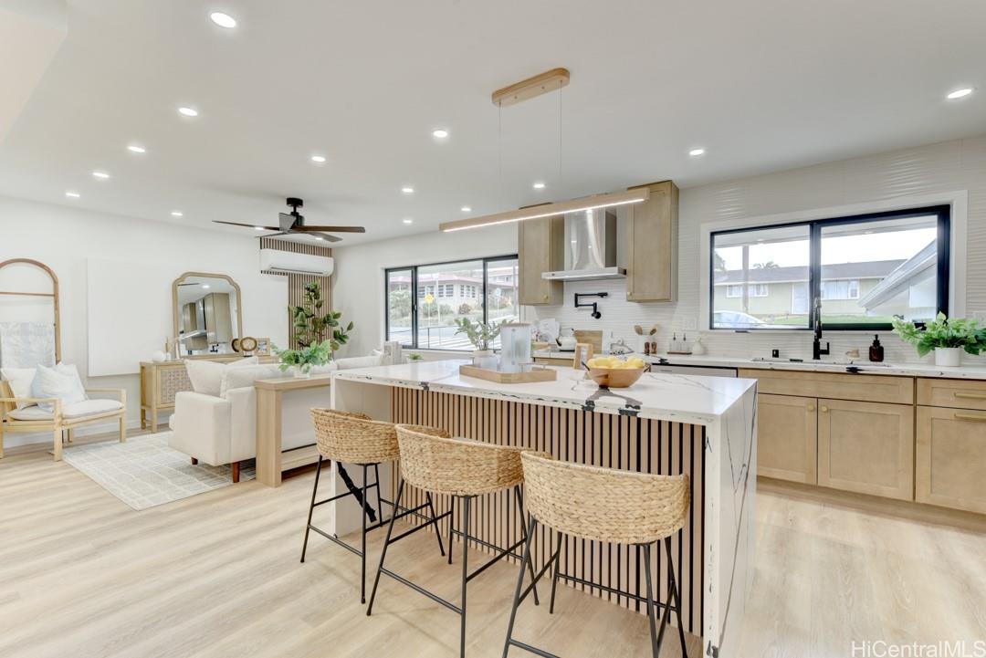 1159 Loho Street Kailua, HI 96734 - Photo 6 of 25 a kitchen with counter top space a sink appliances and cabinets