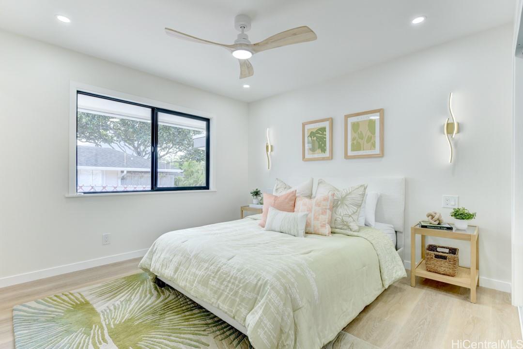 1159 Loho Street Kailua, HI 96734 - Photo 10 of 25 a bedroom with a bed and a painting on the wall