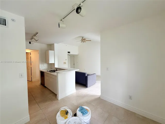 a kitchen with stainless steel appliances a refrigerator a stove and a sink