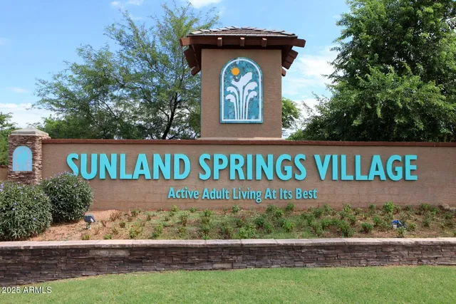 a view of a grassy field with an ocean
