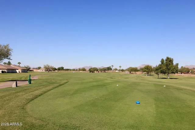 a view of a house with pool and ocean view