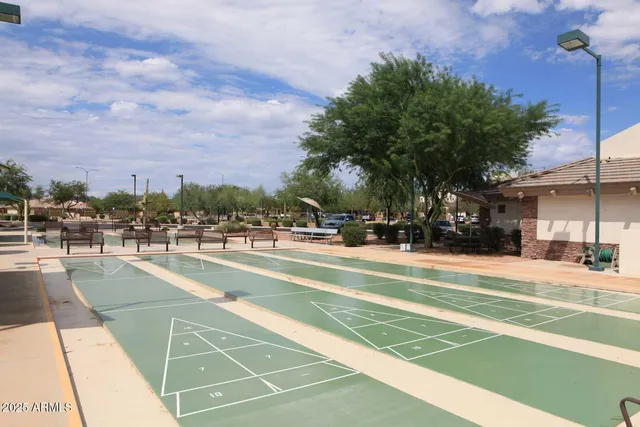 a view of house with swimming pool yard and outdoor seating