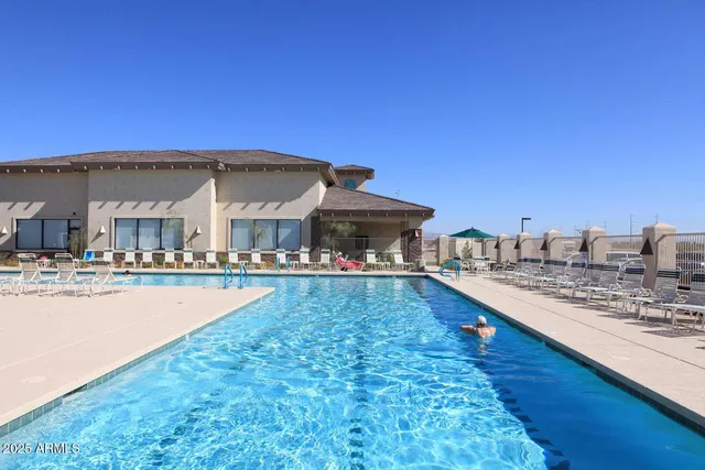 a view of swimming pool with outdoor space and seating area