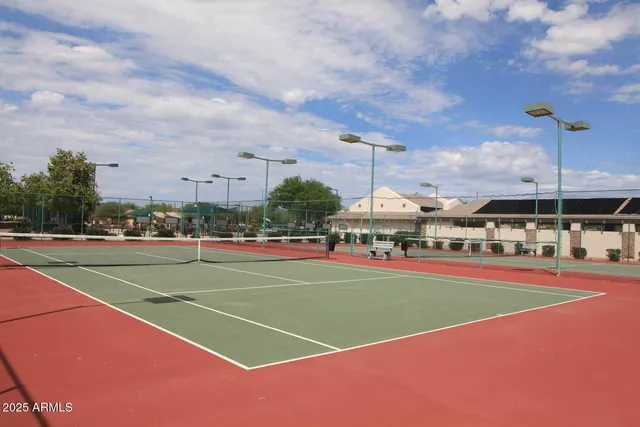 a view of an outdoor space and tennis court