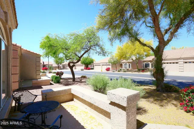 a view of backyard with outdoor seating