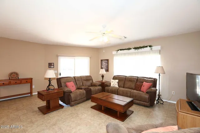 a living room with furniture and a window