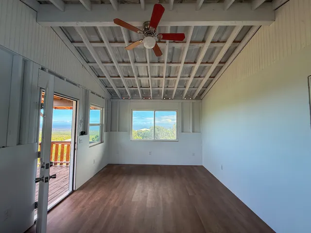 a view of balcony with wooden floor and iron stairs