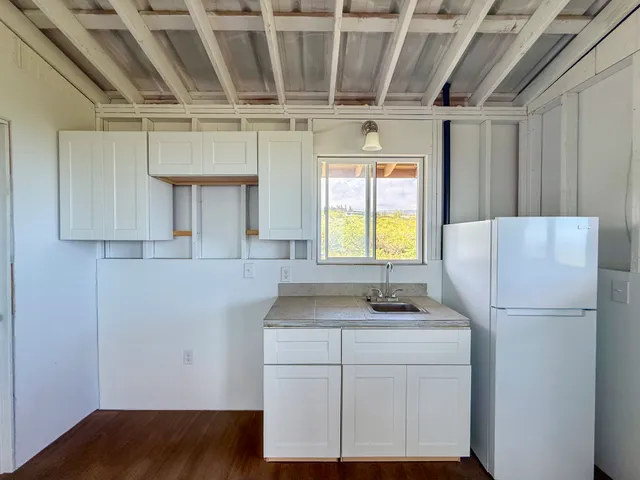 a view of a balcony with wooden floor