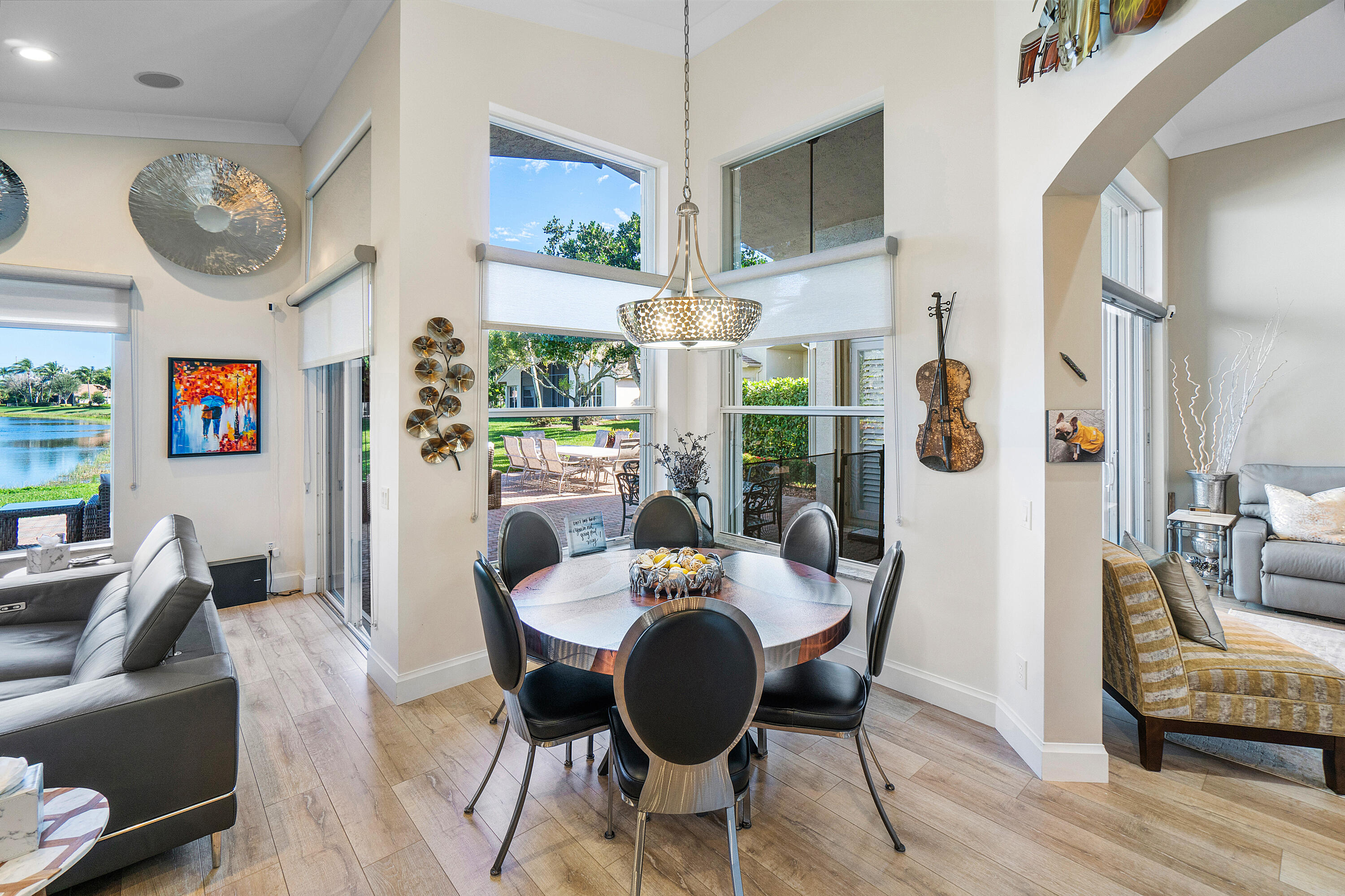 13506 Shell Beach Court Delray Beach, FL 33446 - Photo 13 of 66 a view of a dining room with furniture window and wooden floor
