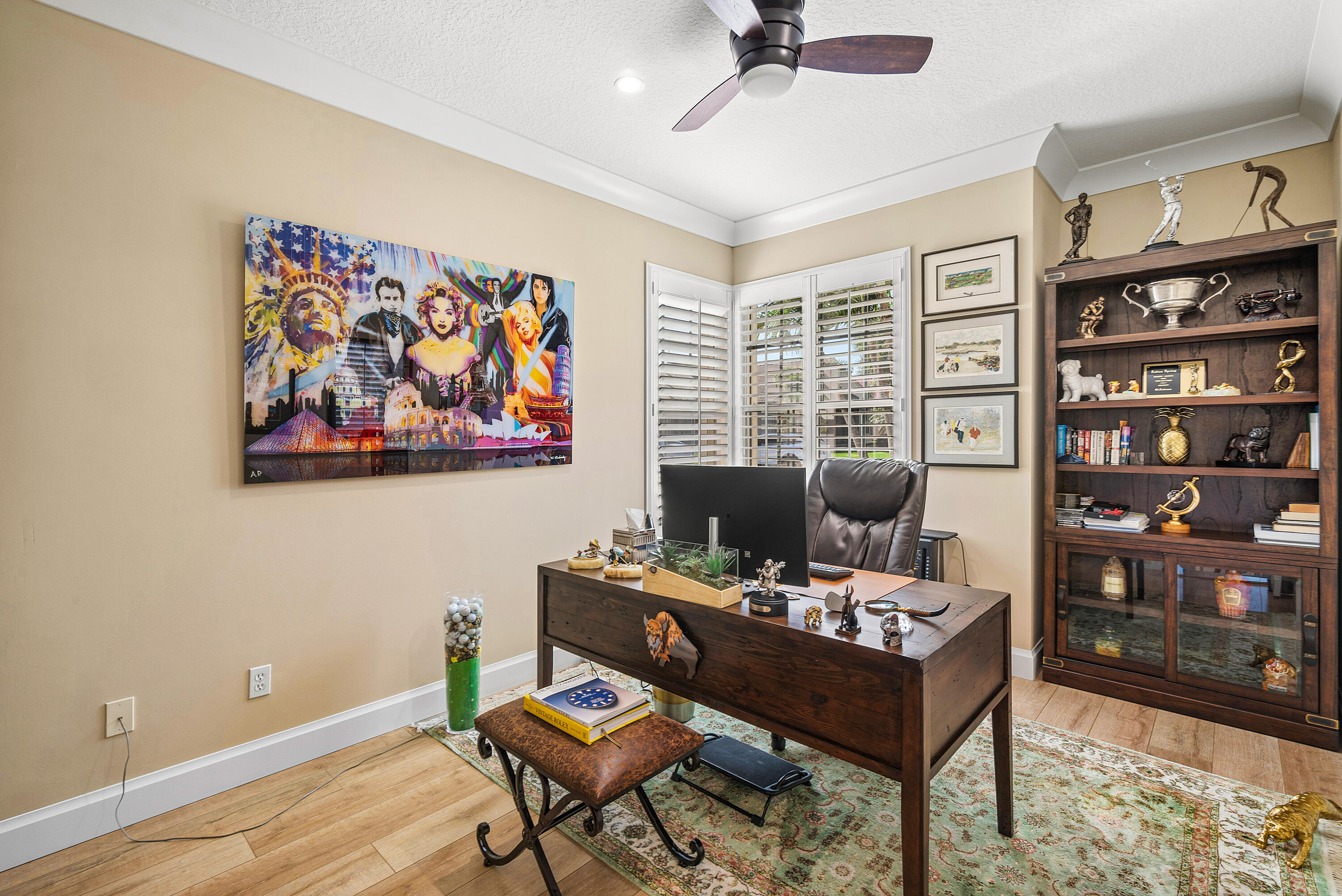 13506 Shell Beach Court Delray Beach, FL 33446 - Photo 36 of 66 a view of a workspace with furniture and a bookshelf