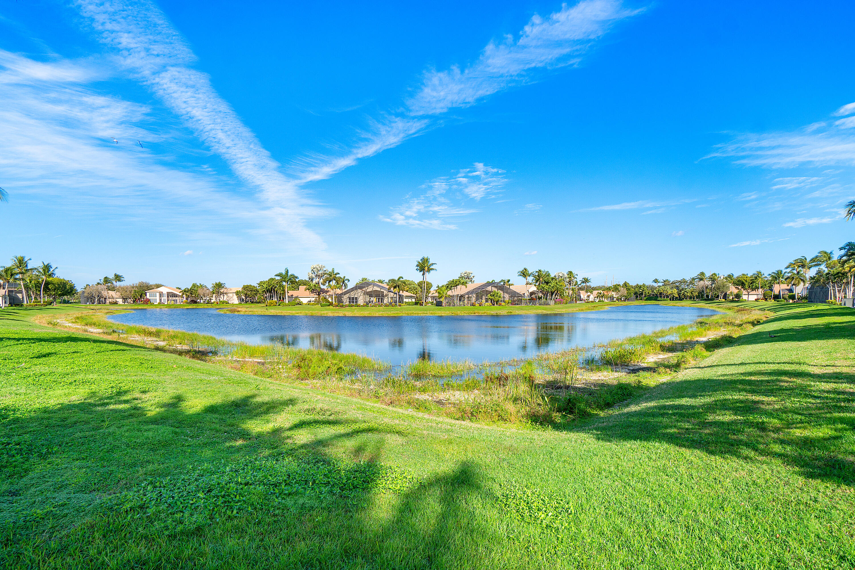 13506 Shell Beach Court Delray Beach, FL 33446 - Photo 45 of 66 a view of a lake with a houses