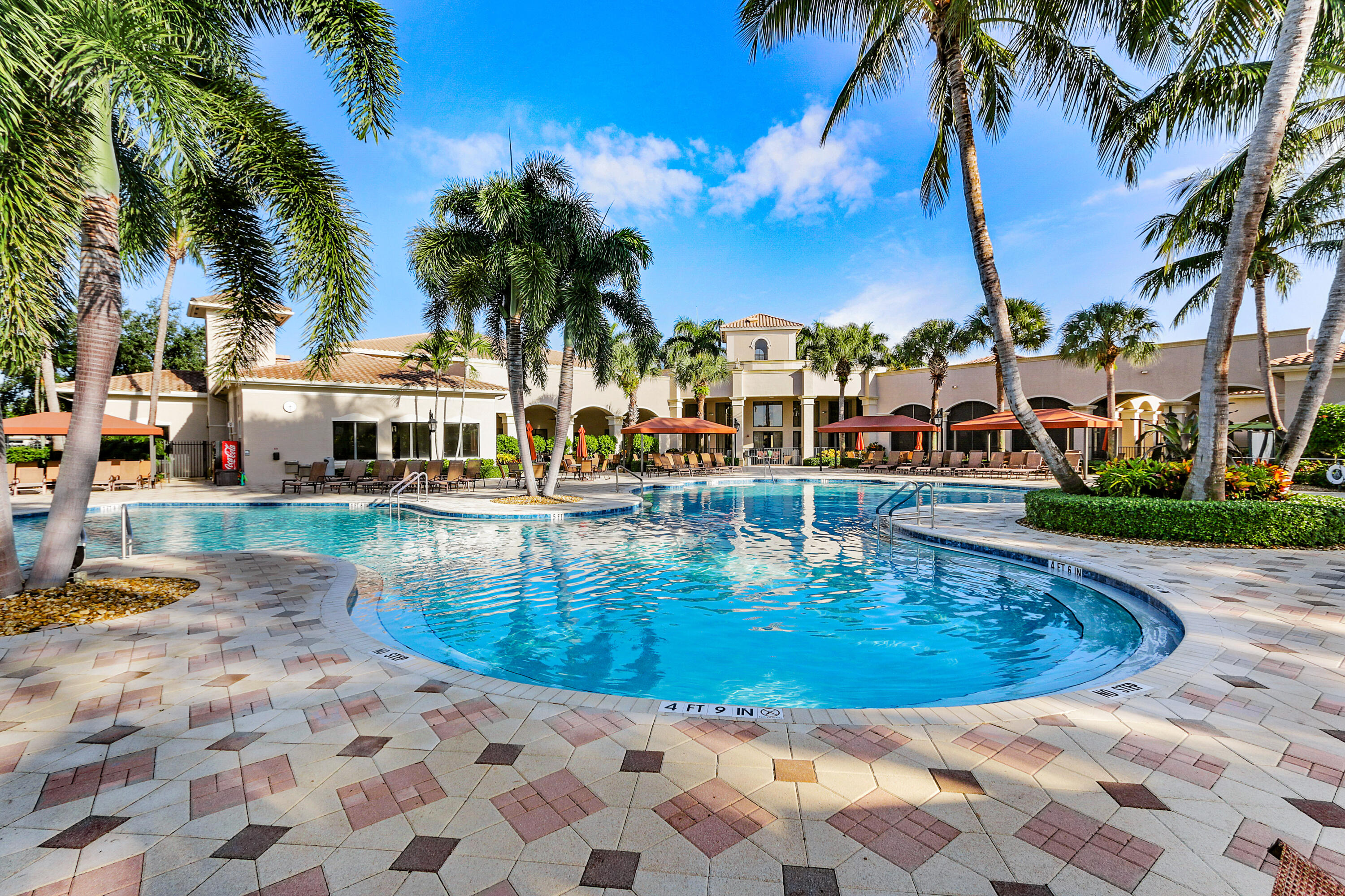13506 Shell Beach Court Delray Beach, FL 33446 - Photo 60 of 66 a view of a swimming pool with an outdoor space and seating area