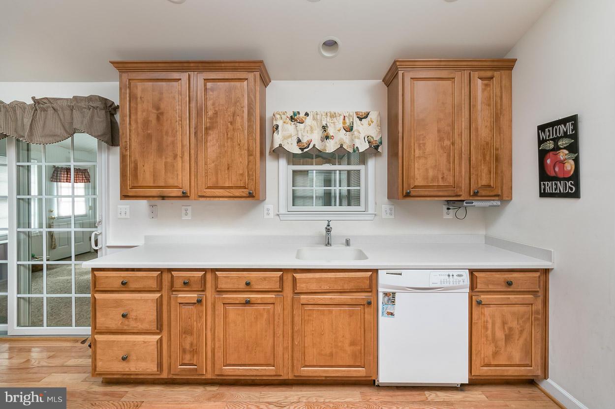 3726 Grave Run Road Hampstead, MD 21074 - Photo 12 of 30 a kitchen with stainless steel appliances granite countertop a stove and a white cabinets