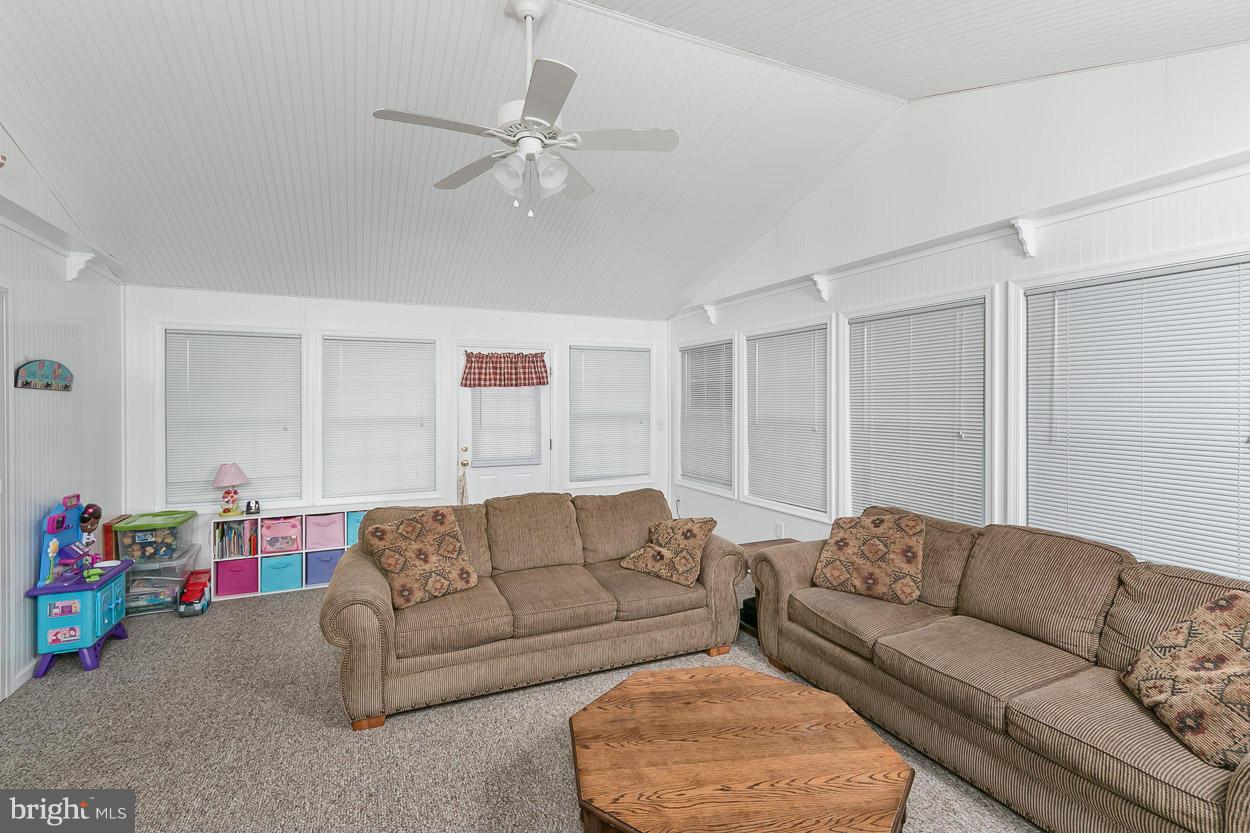 3726 Grave Run Road Hampstead, MD 21074 - Photo 13 of 30 a living room with furniture and a chandelier