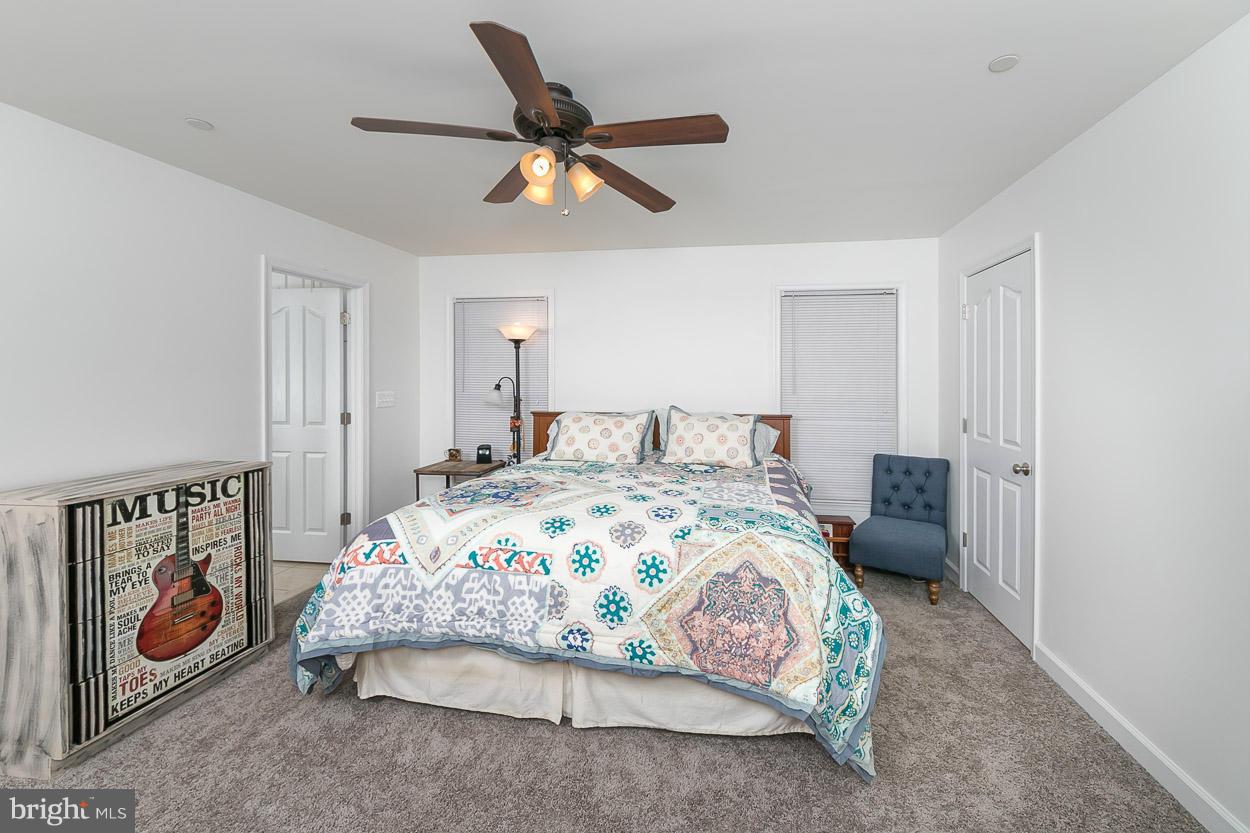 3726 Grave Run Road Hampstead, MD 21074 - Photo 15 of 30 a bedroom with a bed and a painting on the wall
