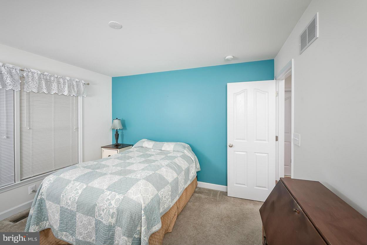 3726 Grave Run Road Hampstead, MD 21074 - Photo 17 of 30 a bedroom with a bed and a window