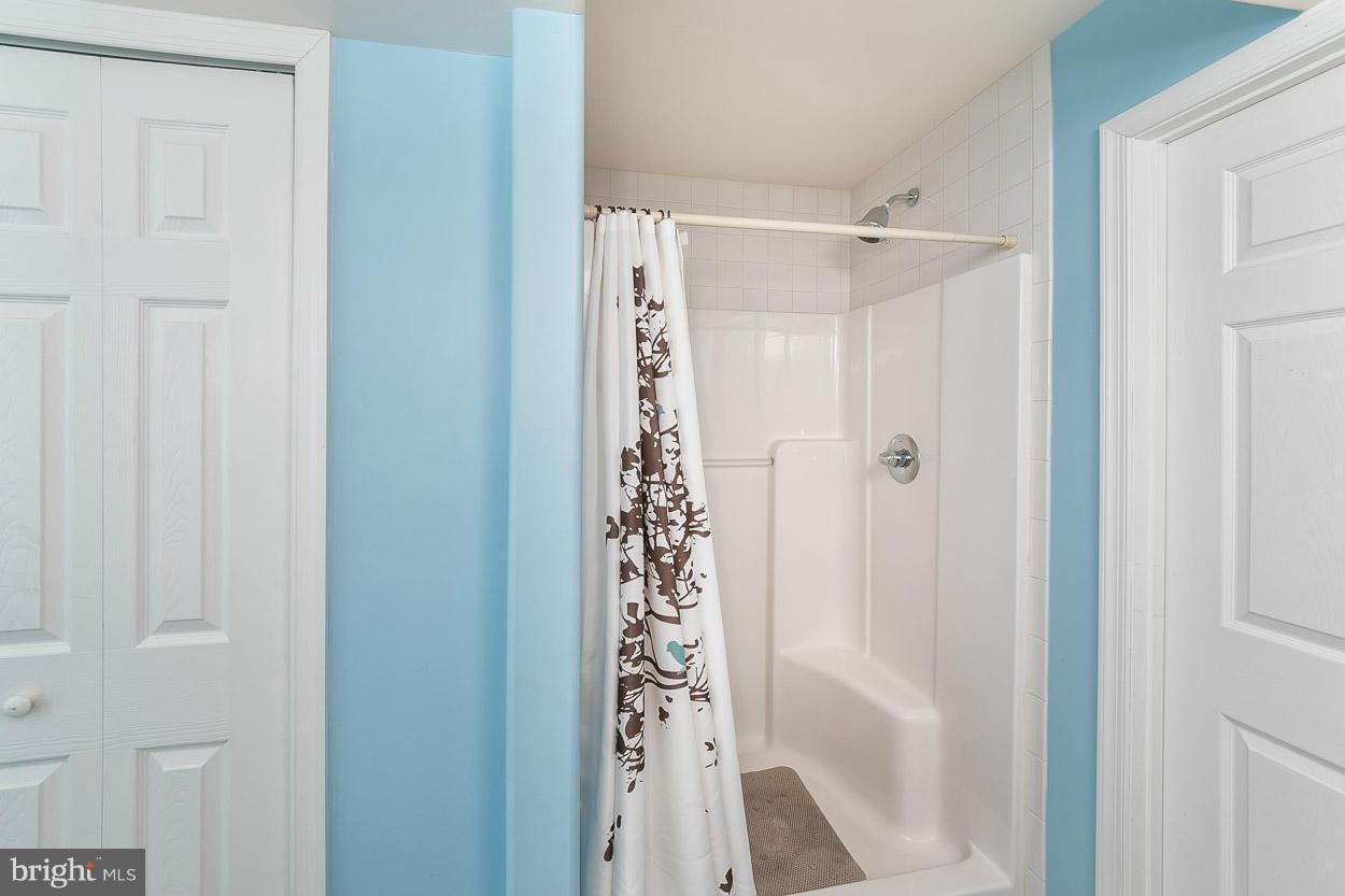 3726 Grave Run Road Hampstead, MD 21074 - Photo 24 of 30 a bathroom with a shower and a glass door