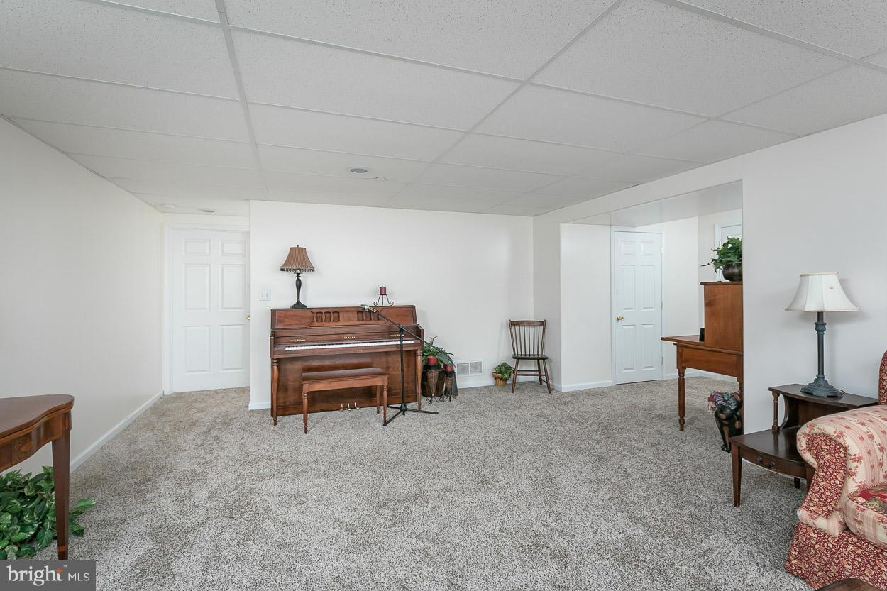 3726 Grave Run Road Hampstead, MD 21074 - Photo 28 of 30 a bedroom with furniture and a chair