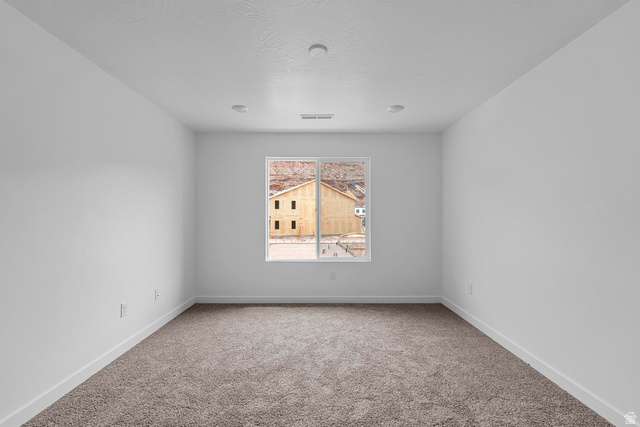 2133 Wolverine Way, Unit 2440 Washington, UT 84780 - Photo 20 of 39 Carpeted room with white walls, recessed ceiling lighting, and a single window
