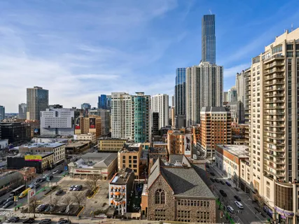 a view of city with tall buildings