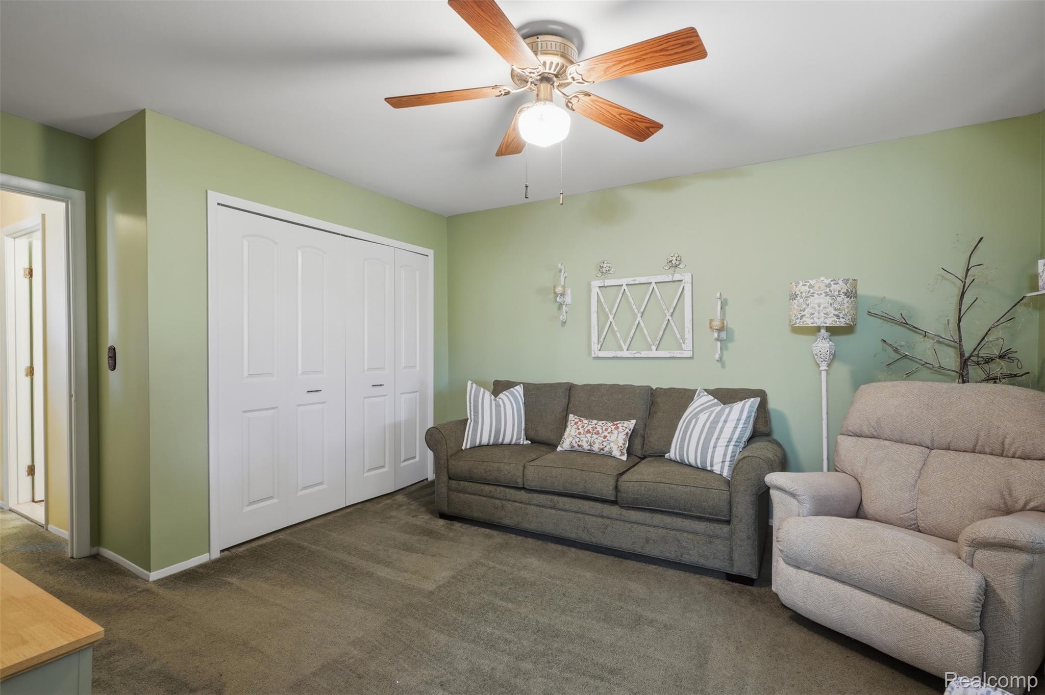 18160 Raleigh Square Drive Southgate, MI 48195 - Photo 9 of 31 Soft green walls complement the neutral carpeted flooring