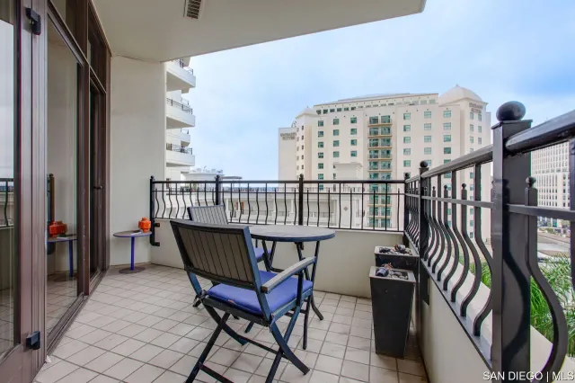 a view of a balcony with furniture