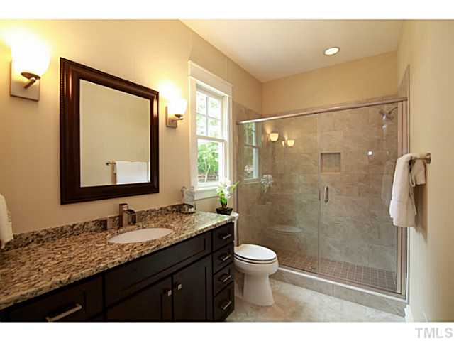 610 Chamberlain Street Raleigh, NC 27607 - Photo 11 of 25 Full downstairs bath, connected to the study or 5th bedroom.