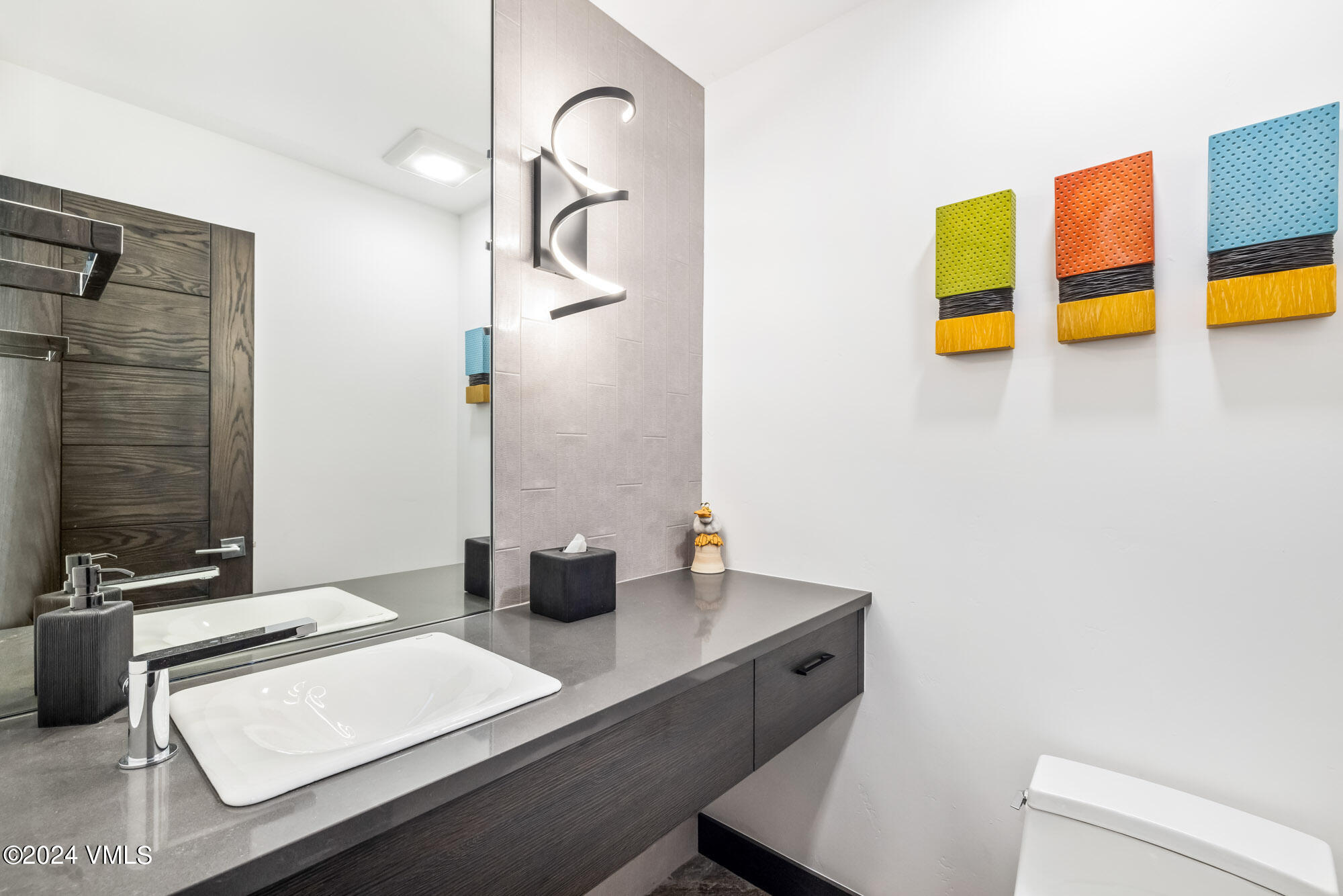 3891 Big Horn Road, Unit C Vail, CO 81657 - Photo 12 of 53 a bathroom with a sink and a mirror