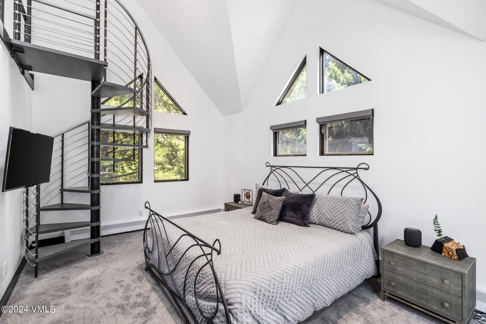 3891 Big Horn Road, Unit C Vail, CO 81657 - Photo 15 of 53 a bedroom with a bed and a window