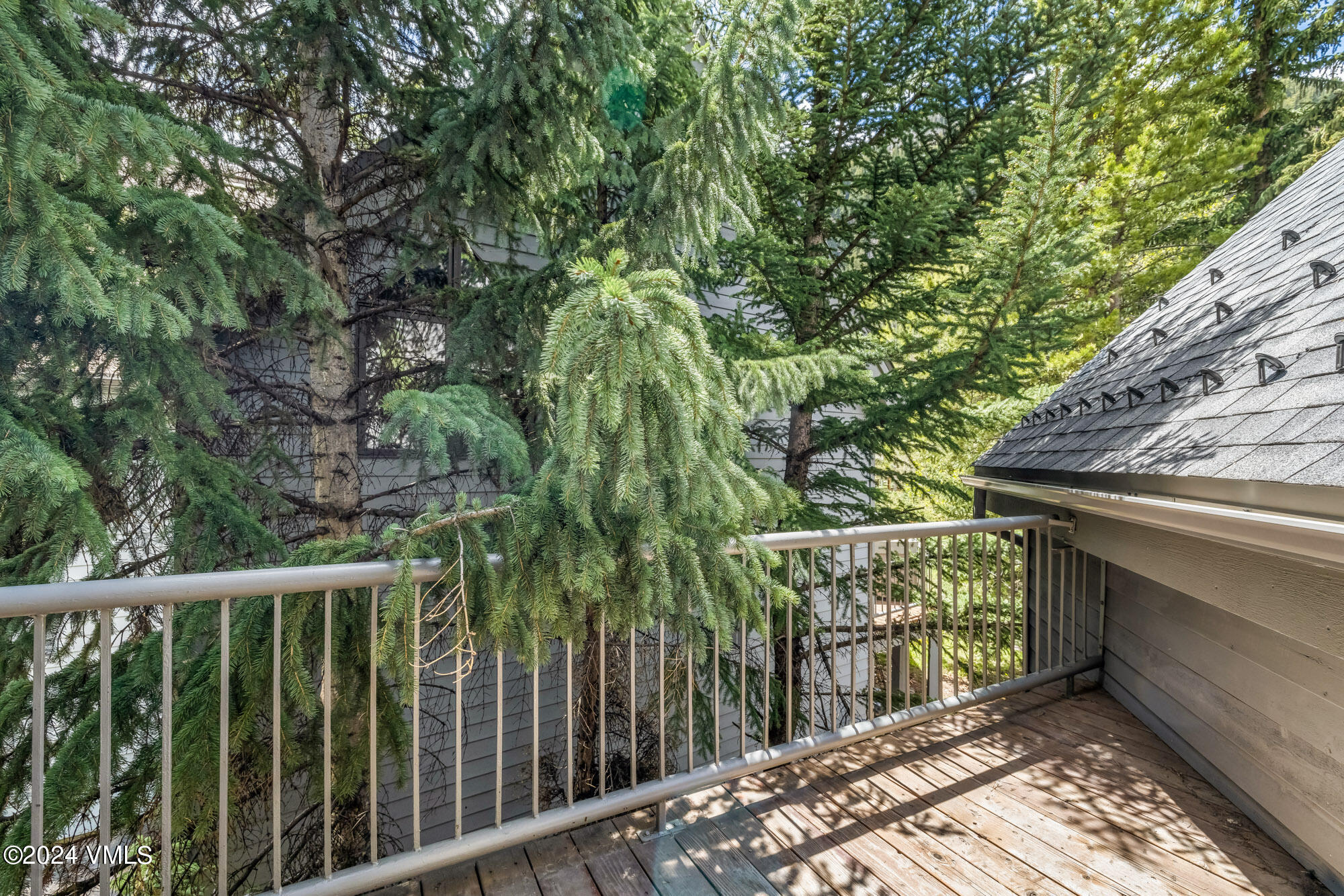 3891 Big Horn Road, Unit C Vail, CO 81657 - Photo 18 of 53 a balcony with trees in front of it
